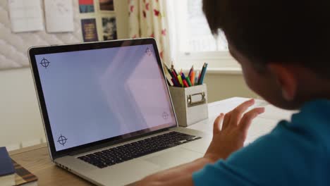 Caucasian-boy-having-a-video-call-on-laptop-with-copy-space-at-home