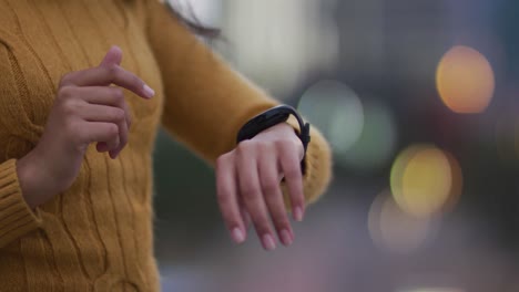 Asian-woman-using-smartwatch