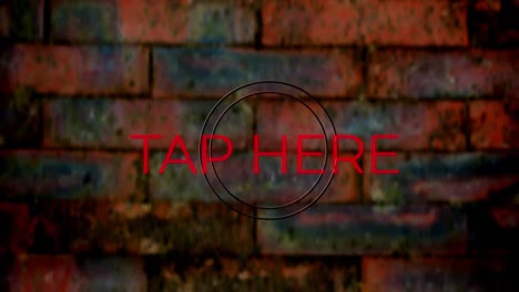 Animation-of-red-neon-text,-tap-here,-on-brick-wall-background