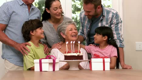 Animation-of-burning-layer-over-family-having-fun-at-birthday-party