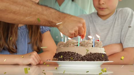 Animation-of-confetti-falling-over-family-having-fun-at-birthday-party