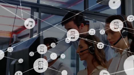 Animation-of-network-of-connections-and-icons-over-business-people-wearing-headsets