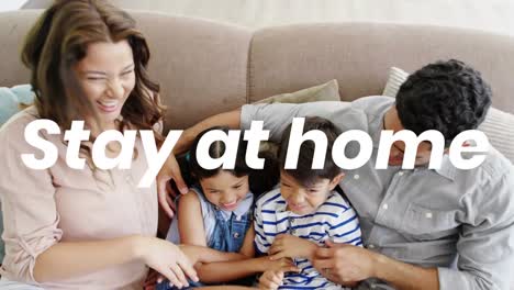 Animation-of-stay-at-home-text-over-parents-with-sister-and-brother-at-home
