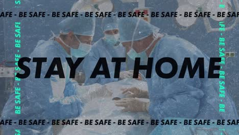 Stay-at-home-and-be-safe-text-against-team-of-surgeons-performing-surgery-at-operation-theatre