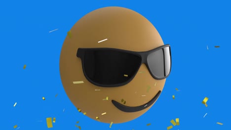 Digital-animation-of-golden-confetti-falling-over-face-wearing-sunglasses-emoji-on-blue-background