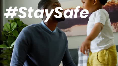 Animation-of-stay-safe-text-over-father-and-daughter-at-home