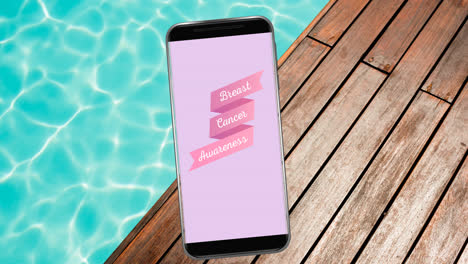Animation-of-pink-breast-cancer-text-on-smartphone-screen