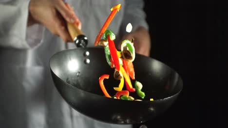 Chef-making-vegetable-stir-fry-in-wok