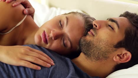 Cute-couple-sleeping-and-cuddling-in-bed