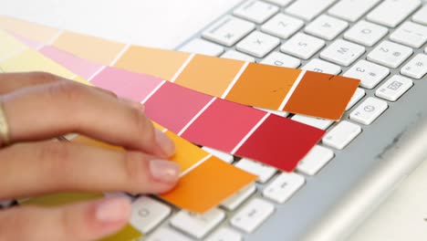 Close-up-of-married-woman-choosing-colours-