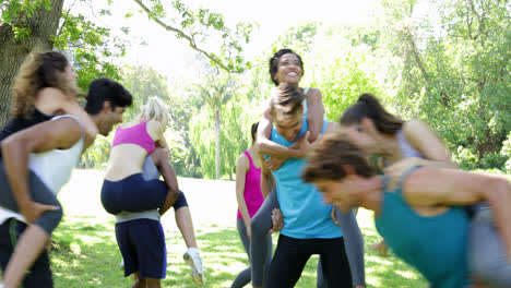 Fit-group-of-friends-having-fun-and-messing-in-the-park