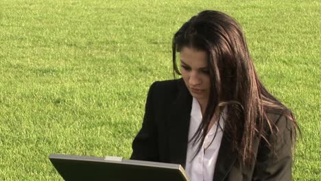 Business-Woman-Working-Outdoors-on-Laptop