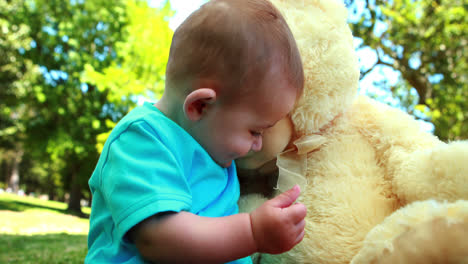 Cute-baby-boy-playing-with-teddy-bear