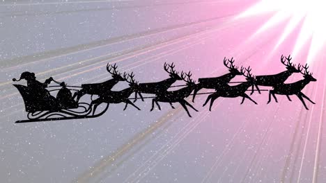 Snow-falling-on-santa-claus-in-sleigh-being-pulled-by-reindeers-against-pink-light-trails