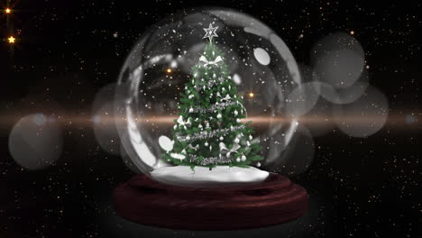 Blue-shooting-star-around-christmas-tree-in-a-snow-globe-against-spots-of-light-on-black-background