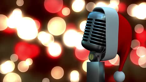 Santa-hat-over-microphone-against-red-and-yellow-spots-of-light-against-black-background