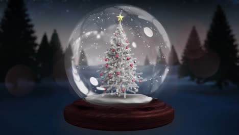 Blue-shooting-stars-spinning-around-christmas-tree-in-a-snow-globe-on-winter-landscape