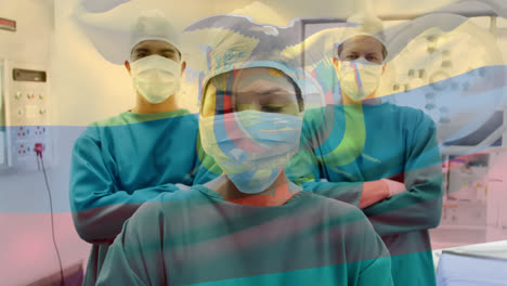 Animation-of-flag-of-ecuador-waving-over-surgeons-in-operating-theatre