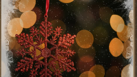 Animation-of-christmas-decoration-over-snow-and-bokeh