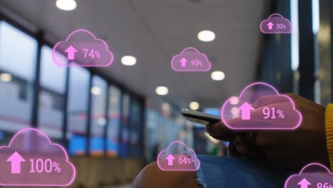 Animation-of-digital-clouds-with-percent-going-up-over-man-using-smartphone
