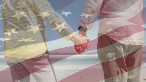 Animation-of-senior-caucasian-couple-holding-hands-on-beach-over-flag-of-united-states-of-america