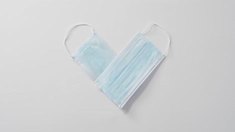 Heart-shape-face-masks-on-white-background-at-valentine's-day