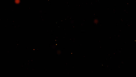 Animation-of-glowing-red-particles-moving-on-black-background