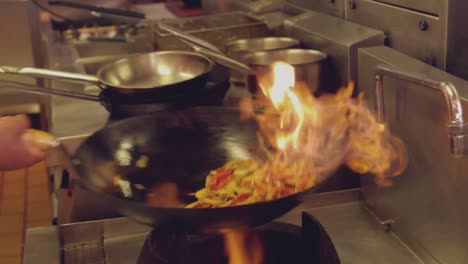 Chef-tossing-flaming-stir-fry-