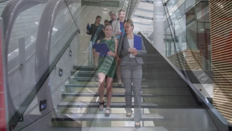 Animation-of-escalator-over-business-people-talking-in-modern-office