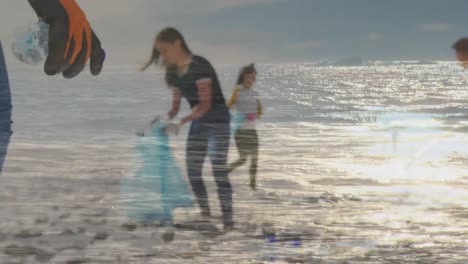 Animation-of-sea-over-diverse-women-picking-plastic-bottles-at-beach