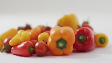 Video-of-fresh-peppers-and-tomatoes-with-copy-space-on-white-background