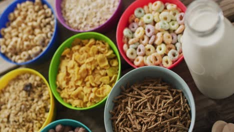 Video-of-cereals-in-colorful-bowls-on-wooden-kitchen-worktop