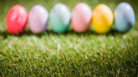 Animation-of-colourful-easter-eggs-on-grass