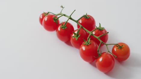 Video-of-fresh-cherry-tomatoes-with-copy-space-on-white-background