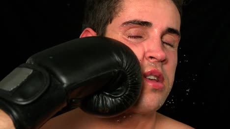 Tough-boxer-taking-a-punch-to-the-face