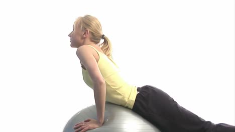 Young-woman-excercising-with-ball