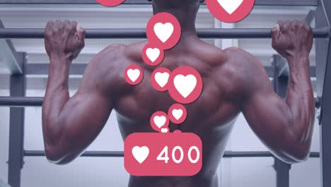 Animation-Von-Social-Media-Reaktionen-über-Der-Rückansicht-Eines-Afroamerikanischen-Mannes,-Der-Im-Fitnessstudio-Trainiert