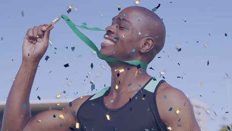 Animation-Von-Konfetti-über-Einem-Glücklichen-Afroamerikanischen-Sportler,-Der-Die-Medaille-Küsst-Und-Den-Sieg-Genießt
