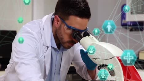 Two-globes-spinning-against-male-caucasian-scientist-using-binoculars-at-the-laboratory