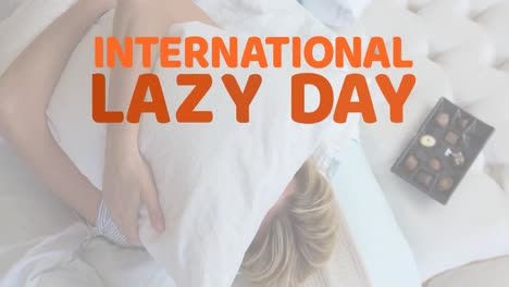 Animation-of-international-lazy-day-text-over-caucasian-woman-lying
