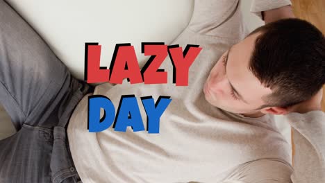Animation-of-lazy-day-text-over-caucasian-man-lying
