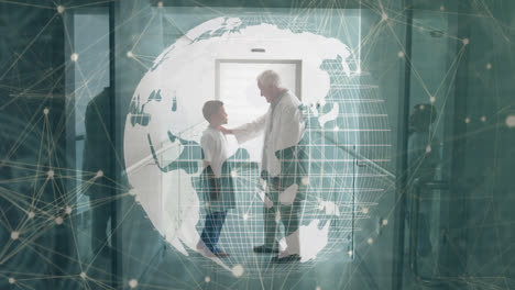 Animation-of-globe-and-connections-over-caucasian-senior-doctor-talking-with-boy
