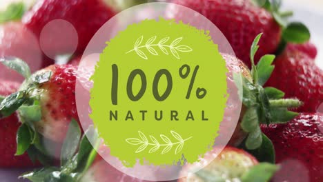 Animation-of-100-percent-natural-text-over-strawberries