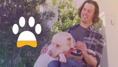 Animation-of-paw-icon-over-happy-caucasian-man-with-dog
