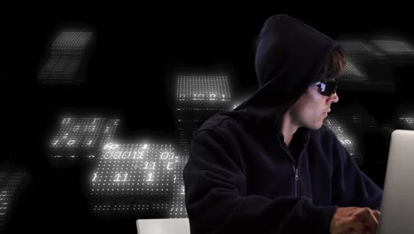 Animation-of-data-processing-and-caucasian-male-hacker-using-laptop-on-black-background