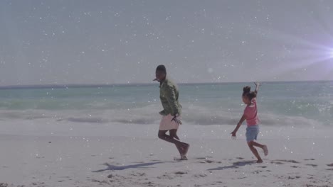 Animation-of-light-trails-over-african-american-man-and-his-daughter-at-beach