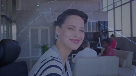 Animation-of-network-of-connections-over-happy-caucasian-woman-looking-at-camera-in-office