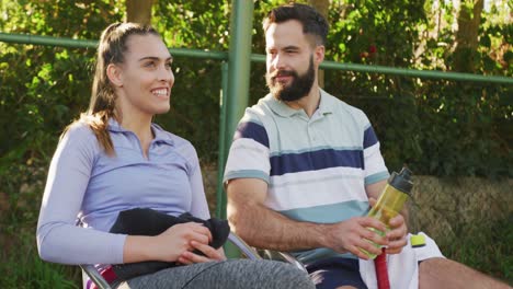 Video-of-happy-caucasian-couple-on-having-break-the-court