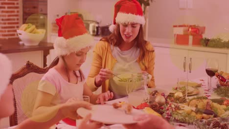 Animation-of-yellow-spots-of-light-caucasian-mother-and-daughter-at-christmas-dinner-table