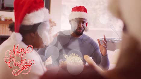 Animation-of-christmas-greetings-text-over-african-american-family-at-christmas-dinner